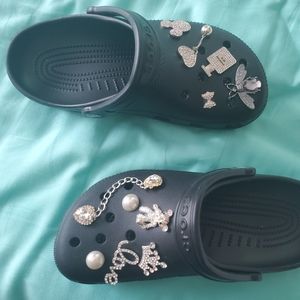 Brand new black women crocs with charms never worn